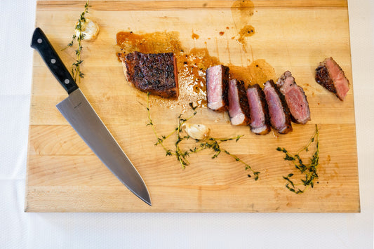 Grilled NY Strip Steak with Slow-Roasted Tomatoes and Chimichurri